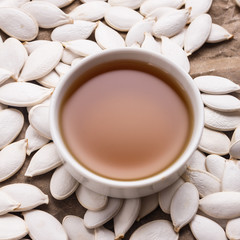 pumpkin seed oil on a rustic background