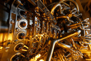 Gas turbine engine of feed gas compressor located inside pressurized enclosure, The gas turbine engine used in offshore oil and gas central processing platform.