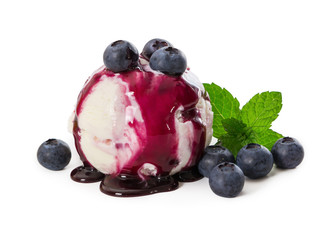 Vanilla ice cream with fresh blueberries and mint leaves, watered syrup