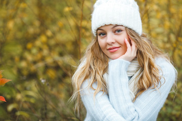 Young attractive woman in autumn colorful background