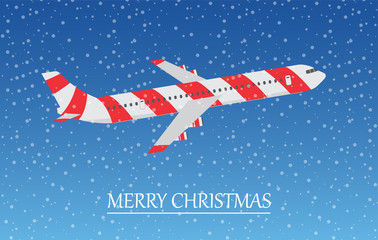Airplane in the sky with snowflakes. Merry Christmas.