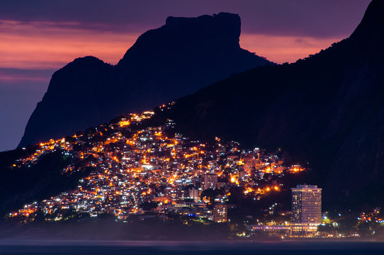 Lights of Vidigal Favela in Rio de Janeiro, at Night, With Mountains