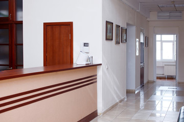 the interior of the hospital corridors, reception, flowers, sofas and walls