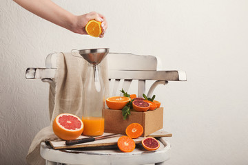 Preparing citrus fresh on white old chair