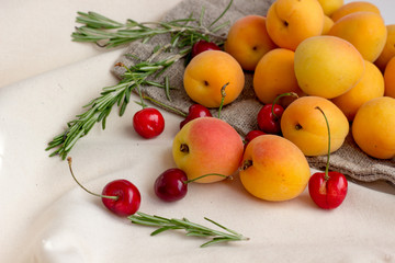 Apricots, Cherries on burlap sack