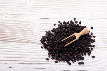dried barberry berries on the rustic background