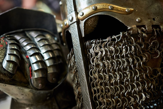 Medieval metal helmet and metal glove