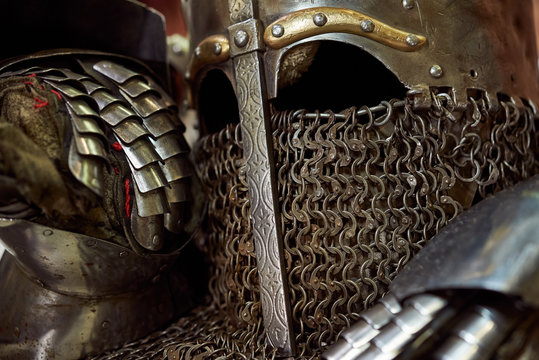 Medieval metal helmet and metal glove