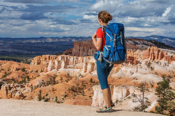 Hiker visits Bryce canyon National park in Utah, USA - obrazy, fototapety, plakaty