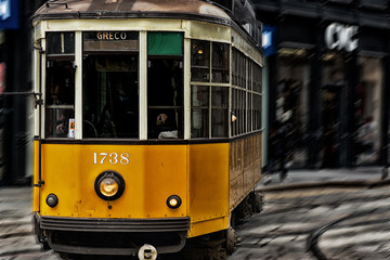 Fototapeta na wymiar Old vintage Milan yellow tram , streetcar and public transport