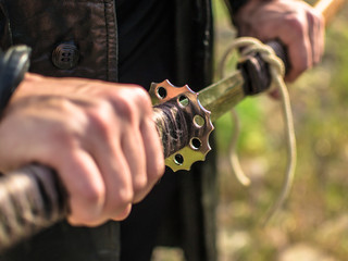 Samurai sword katana in hand. Katana sword holding in Samurai hand prepare to flighting.