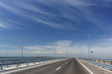 Fototapeta premium Cars driving on the Tuzla spit on the Taman Peninsula on a Sunny day