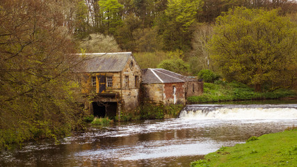 The old stable courtyard, sawmill and weir on the White Cart Water.