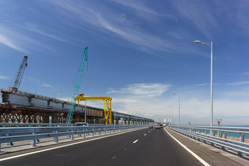 Crimean bridge in may 2018. On the left is the construction of the overpass of the railway bridge