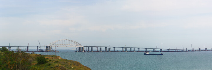 Panoramic view from the Kerch coast to the Crimean bridge connecting the Peninsula of Crimea and Krasnodar region