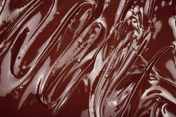Melted chocolate swirl as a background closeup