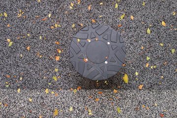 Round rubber design with synthetic surface and fallen leaves