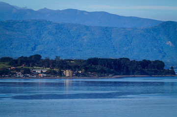 Sector of Pelluco, Reloncaví bosom, hills and the Andes Mountains in the background.