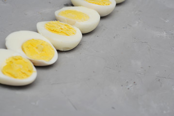 Hard Half Boiled Eggs, Sliced in Halves Food Ingredient Preparation Gray Textured Background