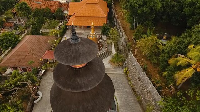 Aerial view of Traditional Buddhist temple Brahma Vihara Arama, Bali,Indonesia. Balinese Temple, Architecture, Ancient design. Travel concept. Aerial footage.