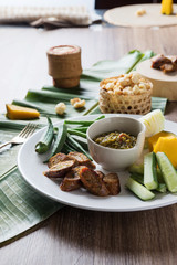 Thai northern food. Nam Prik Num (Northern Thai Green Chilli Dip), Streaky pork with crispy crackling, Sai aua (spicy sausge) and vagetable