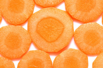 Fresh sliced carrot slices on a white background. Close-up