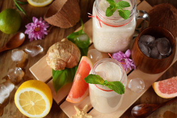 Coconut cocktail decorated with mint in glass jars. Top view
