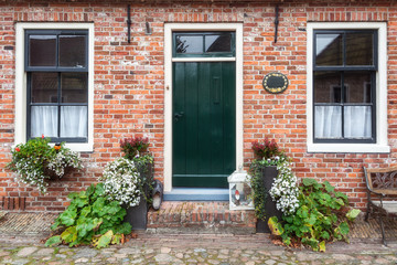 Fototapeta na wymiar The decorated front of a house in Bourtange, a Dutch fortified village in the province of Groningen