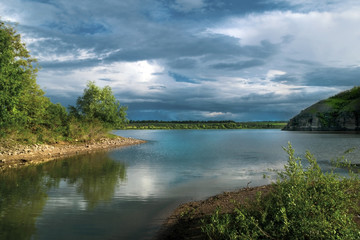 Fototapeta na wymiar Fantastic river landscape with colorful cloudy sky