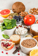 Fototapeta na wymiar Set of organic healthy diet food, superfoods - beans, legumes, nuts, seeds, greens, fruit and vegetables.. white background copy space.