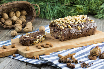 Christmas Walnut ginger bread on wooden board with almonds