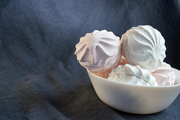 White zephyr marshmallow on porcelain plate