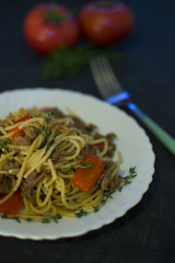 pasta with minced meat and vegetables on a plate