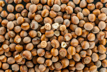 top view over a pile of raw hazelnuts