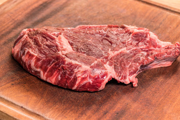 steak of beef on a wooden board