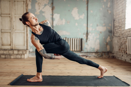 Male yoga doing flexibility exercise