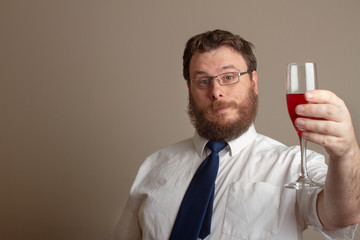 man getting ready to drink some win