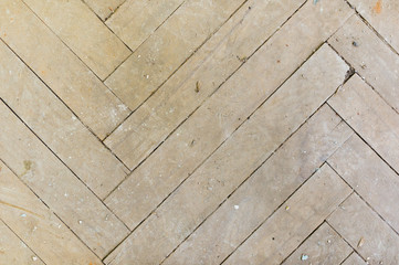 A close-up of an old gray faded parquet covered with dust and dirt. Result of repair. Cleaning and...