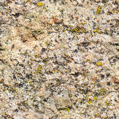 Seamless background of old stone wall texture photo. Colorful old concrete stone wall