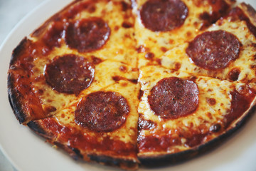 pepperoni pizza on dish , italian food