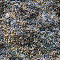 Seamless background of old stone wall texture photo. Colorful old concrete stone wall