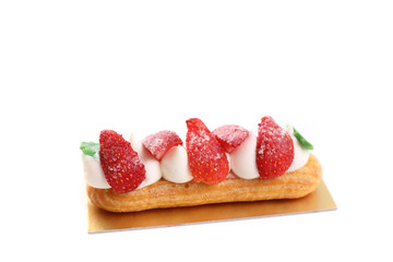 Choux cream with strawberry isolated in white background