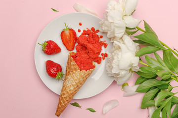 Delicate strawberry ice cream on a white plate. Flatlay on a pink background with white peonies. Top view. Copy space