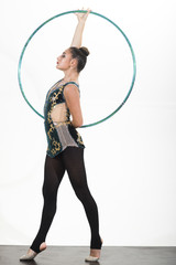 Woman train acrobatics with hula hoop in sportswear. Workout sports activities in gym of flexible girl. Fitness and dieting of girl gymnast. Woman with gymnastic ring. Sport success and health