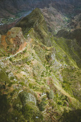Obraz premium Spectacular view above sharp mountain ridge. Green valleys stretch down both sides of the ridge. Trail to Caculi Cape Verde Santo Antao