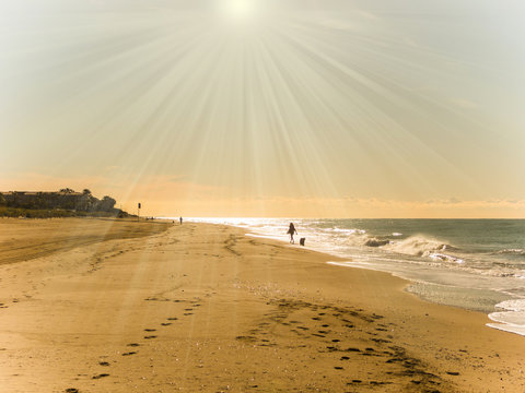 Gav&agrave; beach in Barcelona, a person walking in the morning