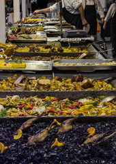 Traditional Hungarian foods (stewed vegetables and meat, goulash, ham, flat cake and sausages) at a street fair stand on the Vorosmarty square, Budapest, Hungary