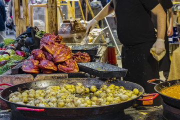 Traditional Hungarian foods (stewed vegetables and meat, goulash, ham, flat cake and sausages) at a...