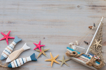 Marine life with seashells, starfish and boat with copy space