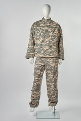 Full-length mannequin in military uniform. White isolated background.
